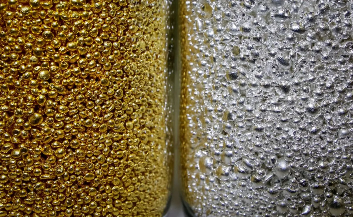 Granules of 99.99 percent pure gold and silver are seen in glass jars at the Krastsvetmet non-ferrous metals plant, one of the world's largest producers in the precious metals industry, in the Siberian city of Krasnoyarsk, Russia, on Nov. 22, 2018. (Ilya Naymushin/Reuters)