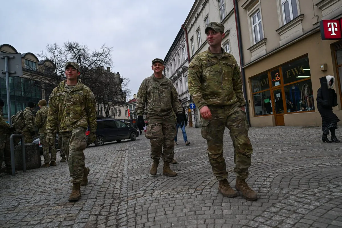 U.S. Army soldiers assigned to the 82nd Airborne walk by the old town in Przemysl, Poland, on March 7, 2022. (Omar Marques/Getty Images)