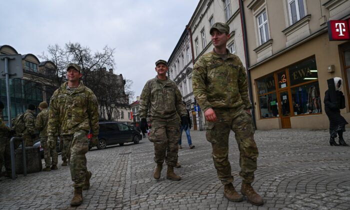 U.S. Army soldiers assigned to the 82nd Airborne walk by the old town in Przemysl, Poland, on March 7, 2022. (Omar Marques/Getty Images)