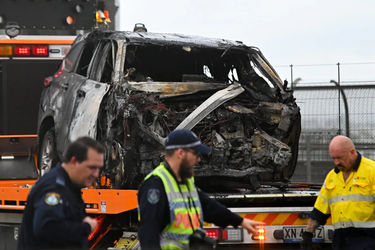 The crash left just a burned husk of one of the three cars. (AAP)