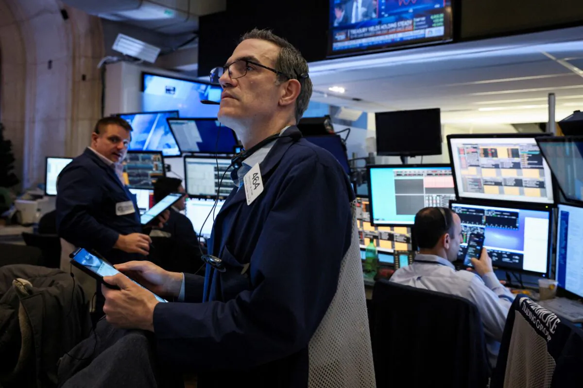 Traders work on the floor of the New York Stock Exchange (NYSE) in New York City, on March 3, 2022. (Brendan McDermid/Reuters)