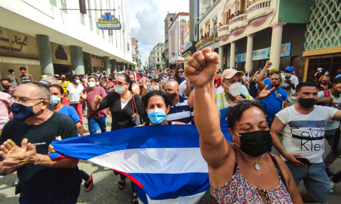 People take part in a demonstration to support the government of the Cuban President Miguel Diaz-Canel in Havana, on July 11, 2021. (Yamil Lage/AFP via Getty Images)