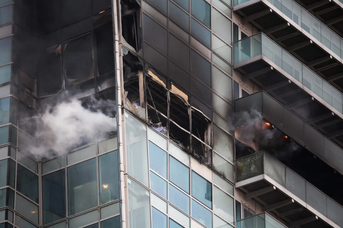 Smoke rises from a burning building in East London, UK, on March 7, 2022. (Phil Noble/Reuters)