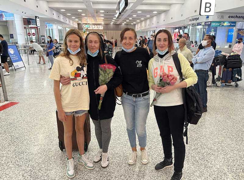 A supplied images shows Ukrainian-Australian family members Veronika Tyshchenko, Raisa Ptashnyk, Maryna Tyshchenko, Iryna Ptashnyk posing for a photograph at Sydney Airport, Sunday, March 6, 2022. (AAP Image/Supplied by Maryna Tyshchenko)
