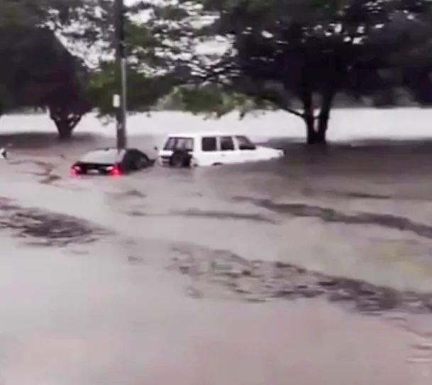 Cars almost submerged across the road from Mackellar Girls High School in Manly Vale on Sydney's Northern Beaches, Australia on March 8. 2022 (Photo by Epoch Times)