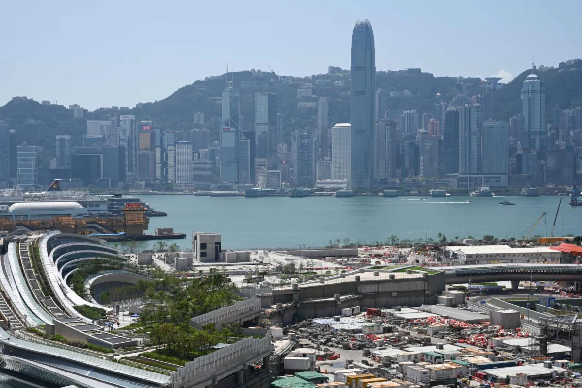A general view shows the harbor-front West Kowloon train station (L) in Hong Kong of the High Speed Rail Link to Guangzhou in China’s Guangdong Province, and the skyline of Hong Kong Island (back) on Sept. 21, 2018. (Anthony Wallace/AFP via Getty Images)
