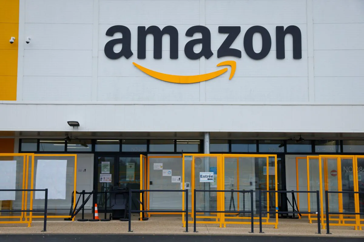 A picture shows the Amazon logo on the frontage of an Amazon's centre in Bretigny-sur-Orge, on Dec. 14, 2021. (Photo by Thomas SAMSON / AFP) (Photo by THOMAS SAMSON/AFP via Getty Images)