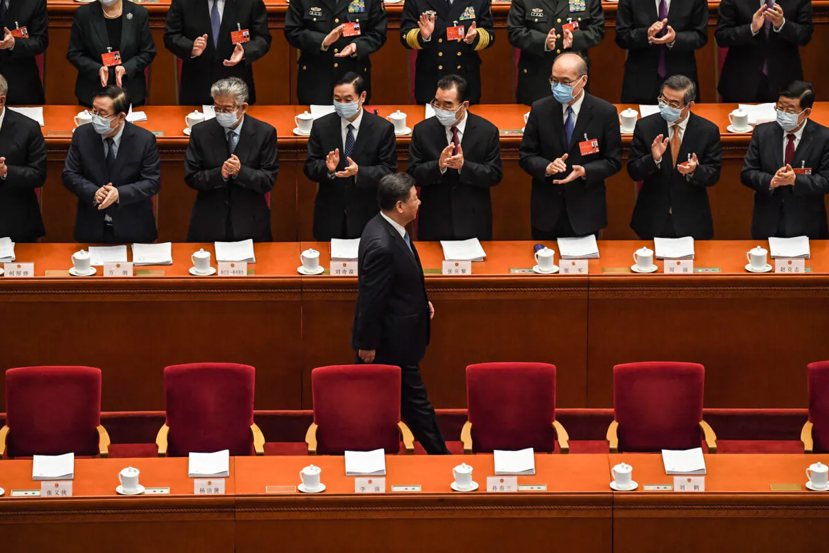 Chinese leader Xi Jinping arrives for the opening session of the rubber-stamp legislature’s conference in Beijing, China, on March 5, 2022. (Leo Ramirez/AFP via Getty Images)