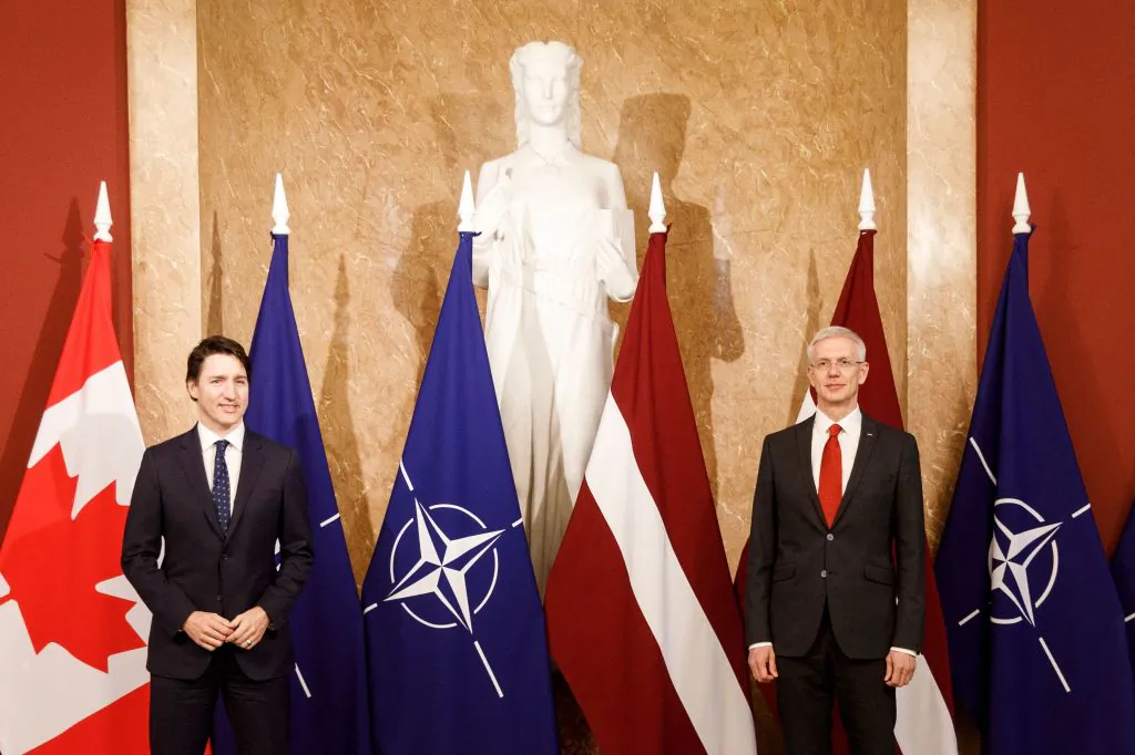 Canada's Prime Minister Justin Trudeau (L) poses with Latvia's Prime Minister Krisjanis Karins ahead of their meeting in Riga, Latvia, on March 8, 2022. (Toms Norde/AFP via Getty Images)