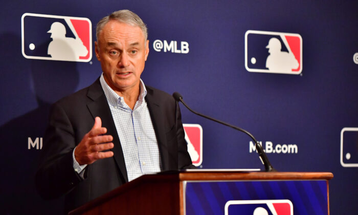 Major League Baseball Commissioner Rob Manfred answers questions during an MLB owner's meeting at the Waldorf Astoria, in Orlando, on Feb. 10, 2022. (Julio Aguilar/Getty Images)