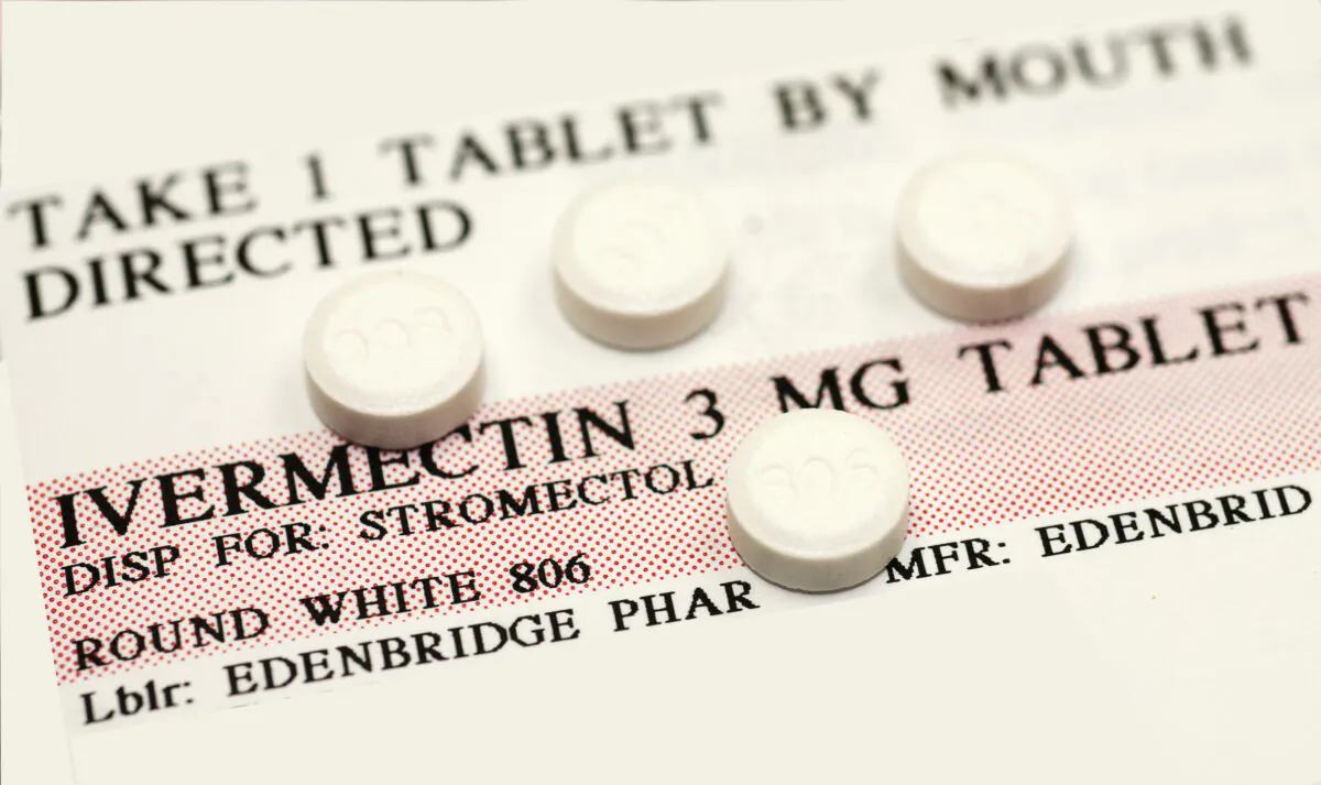 Ivermectin pills on top of an instruction label. (Callista Images/Getty Images)