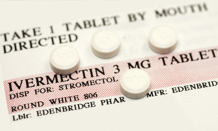 Ivermectin pills on top of an instruction label. (Callista Images/Getty Images)