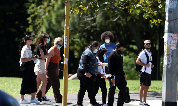 People walk in Auckland, New Zealand, on Feb. 15, 2022. (Phil Walter/Getty Images)
