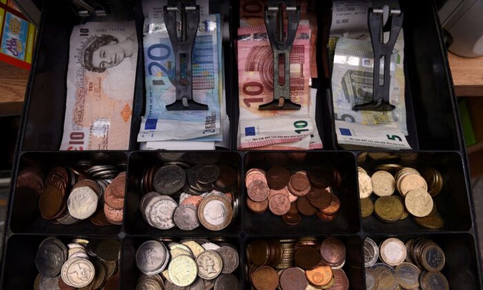 A shop cash register is seen with both Sterling and Euro currency in the till at the border town of Pettigo, Ireland, on Oct. 14, 2016. (Clodagh Kilcoyne/Reuters)