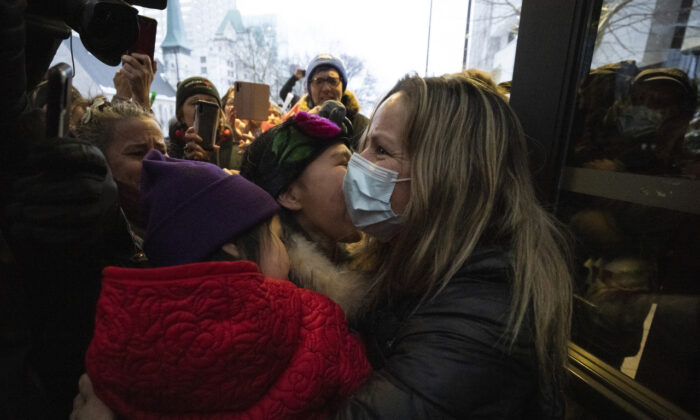 Tamara Lich, an organizer of the Freedom Convoy protest, embraces supporters as she leaves the courthouse in Ottawa after being granted bail, on March 7, 2022. (The Canadian Press/Justin Tang)