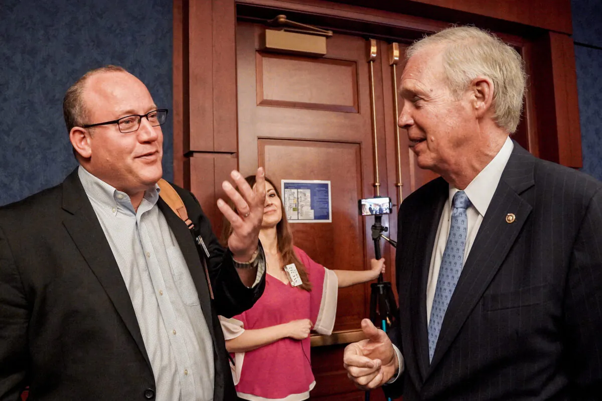 Dr. Pierre Kory (L) and Sen. Ron Johnson (R-Wis.) at the Senate Visitor Center in the U.S. Capitol in Washington on March 8, 2022. (Terri Wu/The Epoch Times)