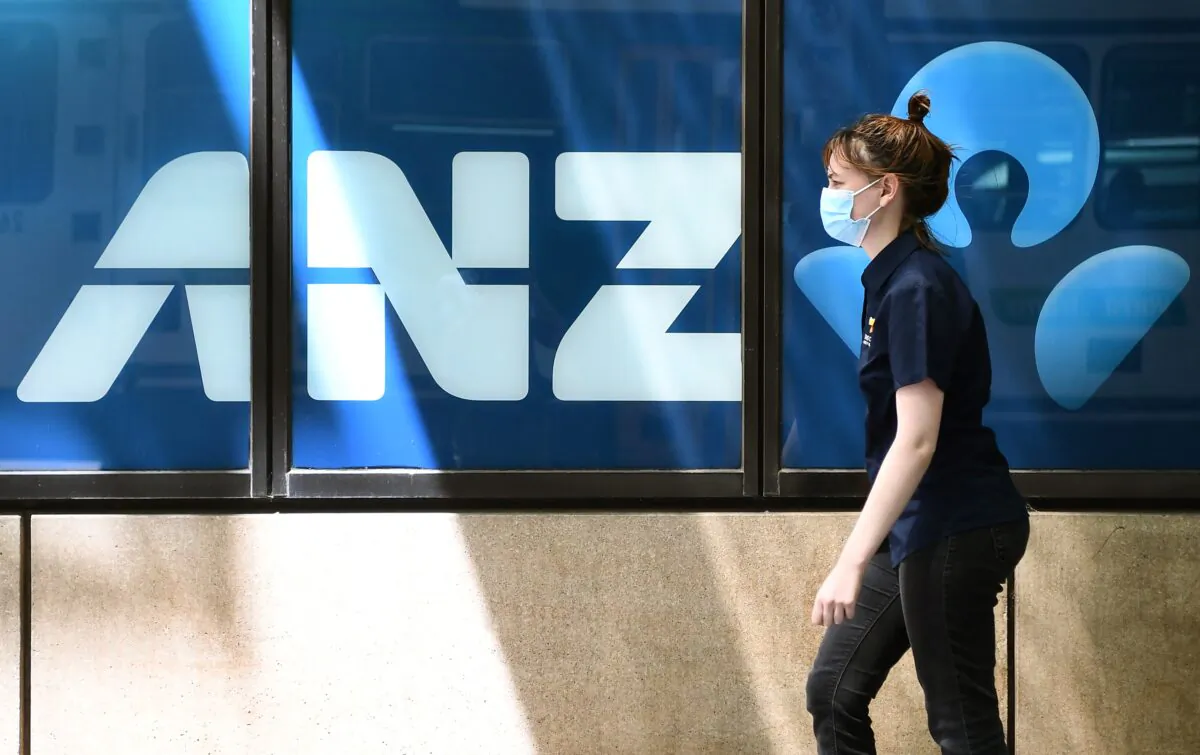 A woman walks past an ANZ Bank in Melbourne on October 28, 2021. (William West/AFP via Getty Images)
