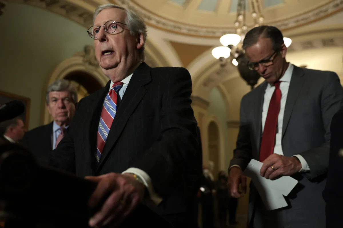 U.S. Senate Minority Leader Sen. Mitch McConnell (R-K.Y.) (2nd L) speaks as Sen. Roy Blunt (R-Mo.), left, and Senate Minority Whip Sen. John Thune (R-S.D.), right, listen during a news briefing after a weekly Senate Republican policy luncheon at the U.S. Capitol in Washington, D.C. on March 8, 2022. (Alex Wong/Getty Images)