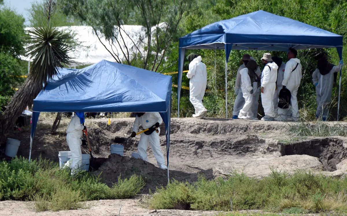 Forensic experts carry out search works for skeletal remains at a clandestine grave in Mexico on Aug. 23, 2021. (Alfredo Estrella/AFP via Getty Images)