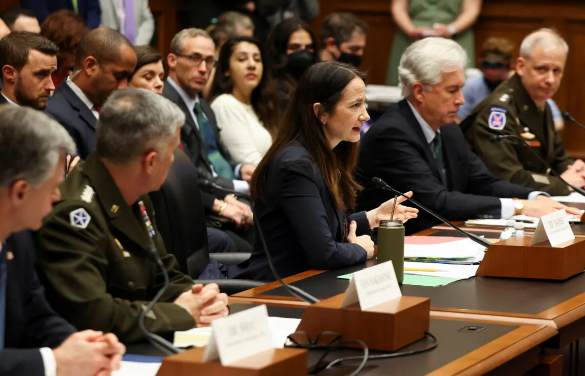 Director of National Intelligence Avril Haines (C) and other U.S. intelligence officials testify to members of Congress in Washington on March 8, 2022. (Evelyn Hockstein/Reuters)