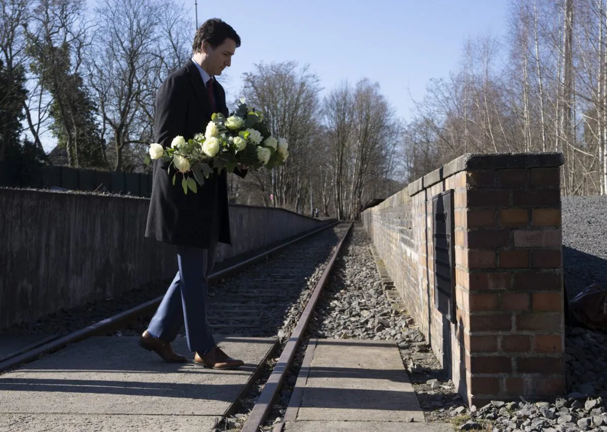 Canadian Prime Minister Justin Trudeau lays flowers at the Platform 17 memorial at the Grunewald S-Bahn train station in Berlin, Germany, March 9, 2022. (The Canadian Press/Adrian Wyld)