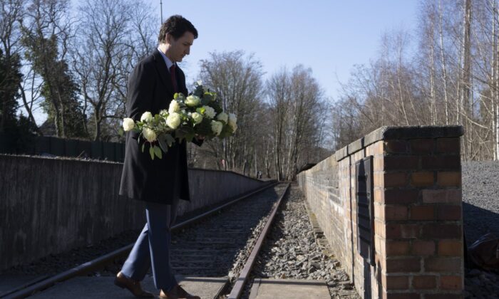 Canadian Prime Minister Justin Trudeau lays flowers at the Platform 17 memorial at the Grunewald S-Bahn train station in Berlin, Germany, March 9, 2022. (The Canadian Press/Adrian Wyld)