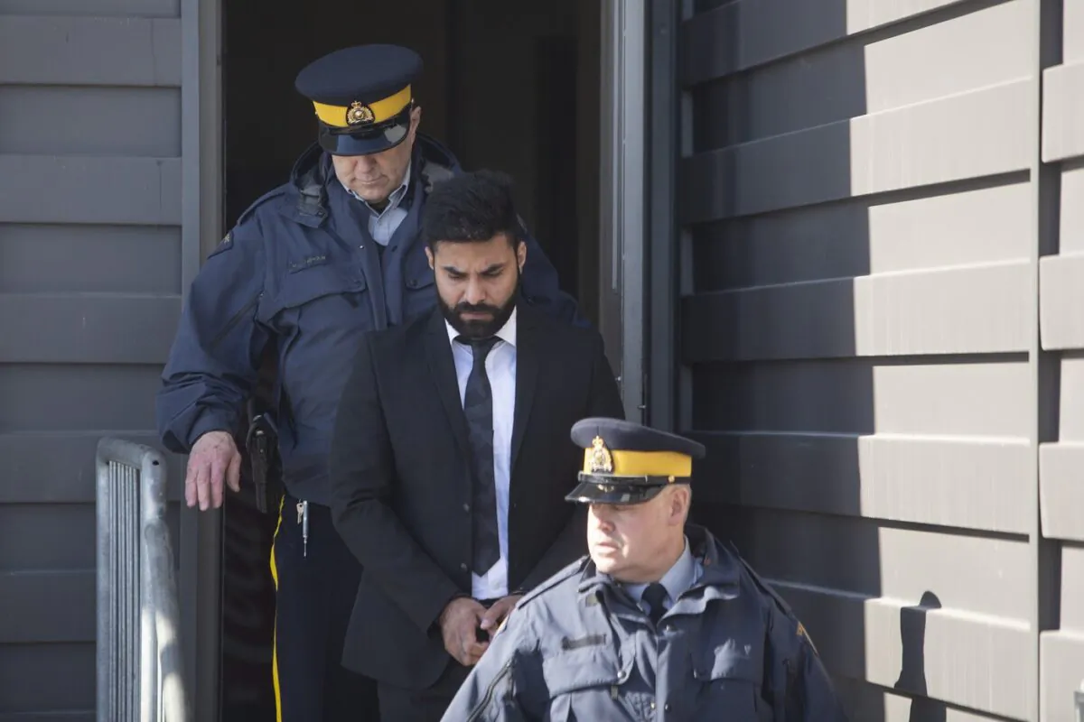 Jaskirat Singh Sidhu is taken out of the Kerry Vickar Centre by RCMP following his sentencing for the Humboldt Broncos bus crash in Melfort, Sask., on March, 22, 2019. (The Canadian Press/Kayle Neis)