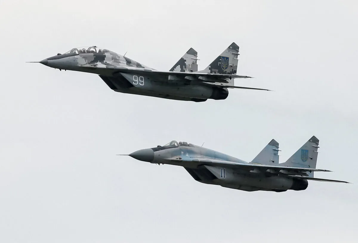 MIG-29 fighter aircraft fly over a military air base in Vasylkiv, Ukraine, in a file image. (Gleb Garanich/Reuters)