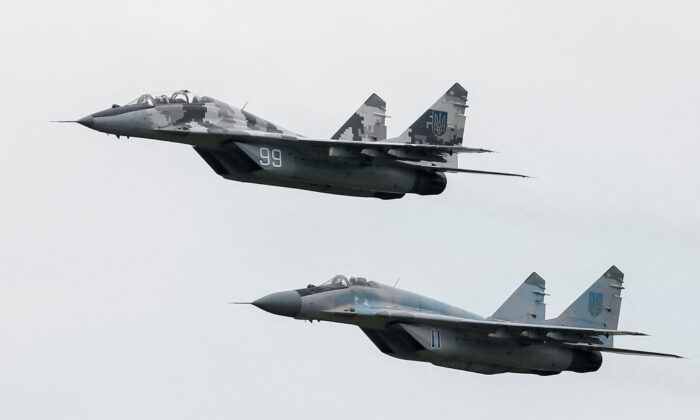 MiG-29 fighter aircraft fly at a military air base in Vasylkiv, Ukraine, in a file image. (Gleb Garanich/Reuters)
