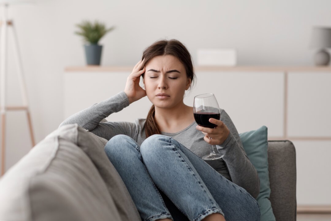 “Wine headache” is a real thing, though it may not be due to sulfites. (Prostock-studio/Shutterstock)