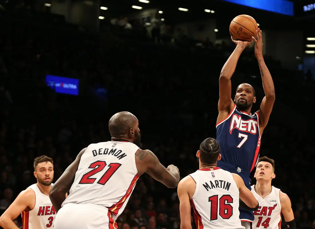 Brooklyn Nets forward Kevin Durant (7) shoots as Miami Heat center Dewayne Dedmon (21) and Caleb Martin (16) look on during the second half at Barclays Center, Brooklyn, New York, on March 3, 2022. (Andy Marlin/USA TODAY Sports via Field Level Media)