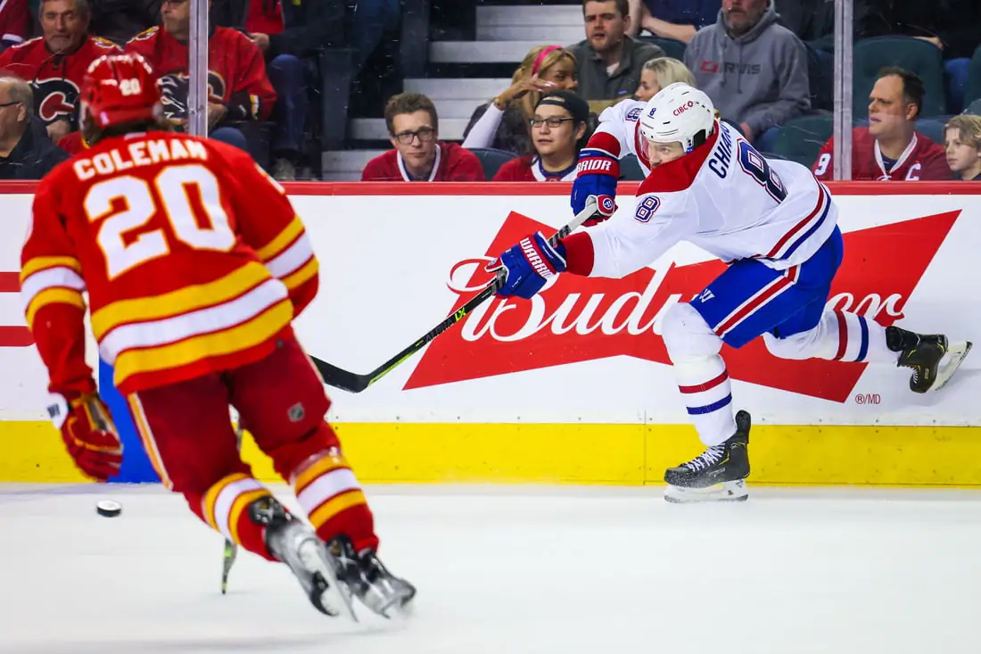 Montreal Canadiens defenseman Ben Chiarot (8) shoot the puck against the Calgary Flames during the third period at Scotiabank Saddledome, in Calgary, Alberta, Canada, on March 3, 2022. (Sergei Belski-USA TODAY Sports via Field Level Media)