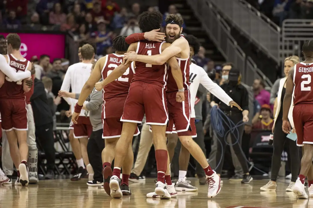 Oklahoma Sooners center Tanner Groves (35) hugs teammate Oklahoma Sooners forward Jalen Hills (1) after defeating the Baylor Bears at T-Mobile Center, in Kansas City, Mo., on March 10, 2022. (Amy Kontras/USA TODAY Sports via Field Level Media)