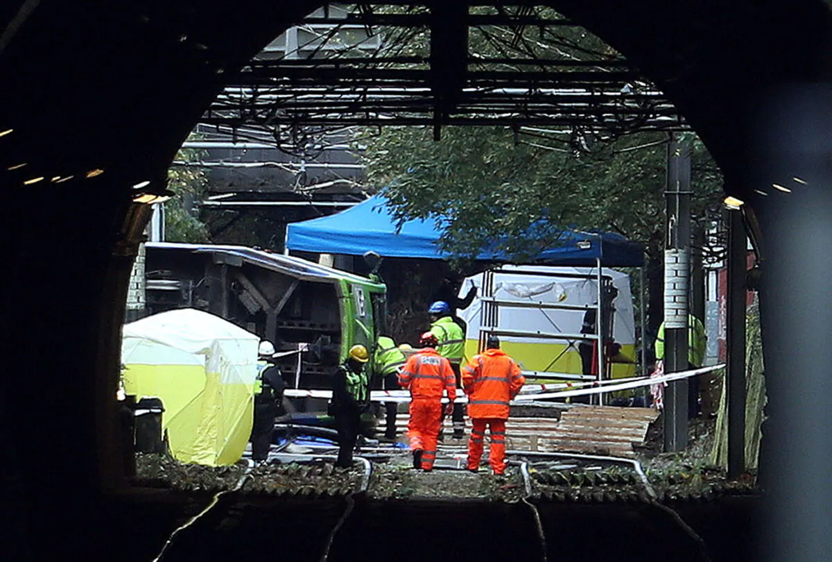 Emergency workers continue to work at the scene of a tram crash in Croydon, England on Nov. 10, 2016.(Steve Parsons/PA)