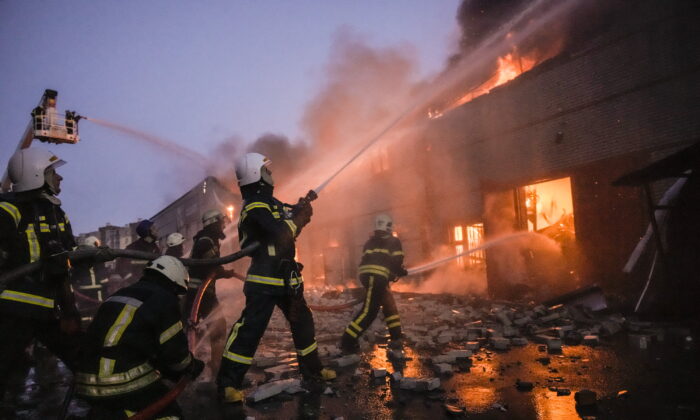 Undated photo showing Ukrainian firefighters battling a blaze in Kyiv. (Vadim Ghirda/AP)