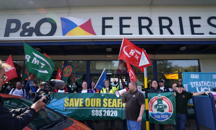 People take part in a demonstration against the dismissal of P&O workers organised by the Rail, Maritime, and Transport (RMT) union at the P&O ferry terminal in Cairnryan, Dumfries and Galloway, on March 23, 2022. (Andrew Milligan/PA Media)