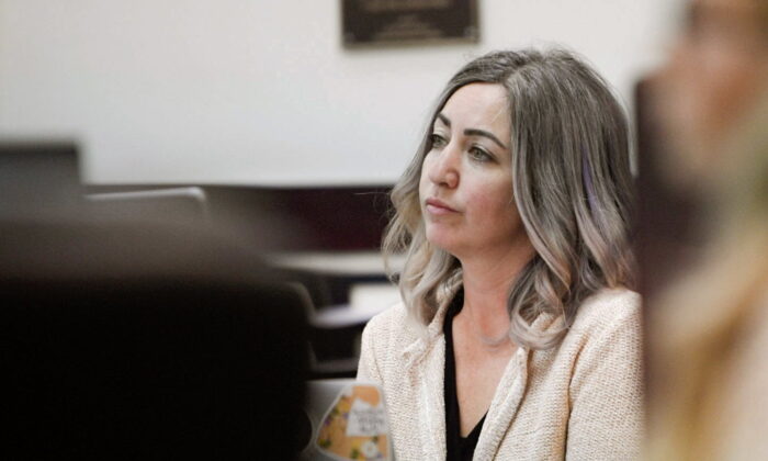 RaDonda Vaught, a former Vanderbilt University Medical Center nurse charged with in the death of a patient, listens to the opening statements during her trial at Justice A.A. Birch Building in Nashville, Tenn., on March 22, 2022.  (Stephanie Amador/The Tennessean via AP)