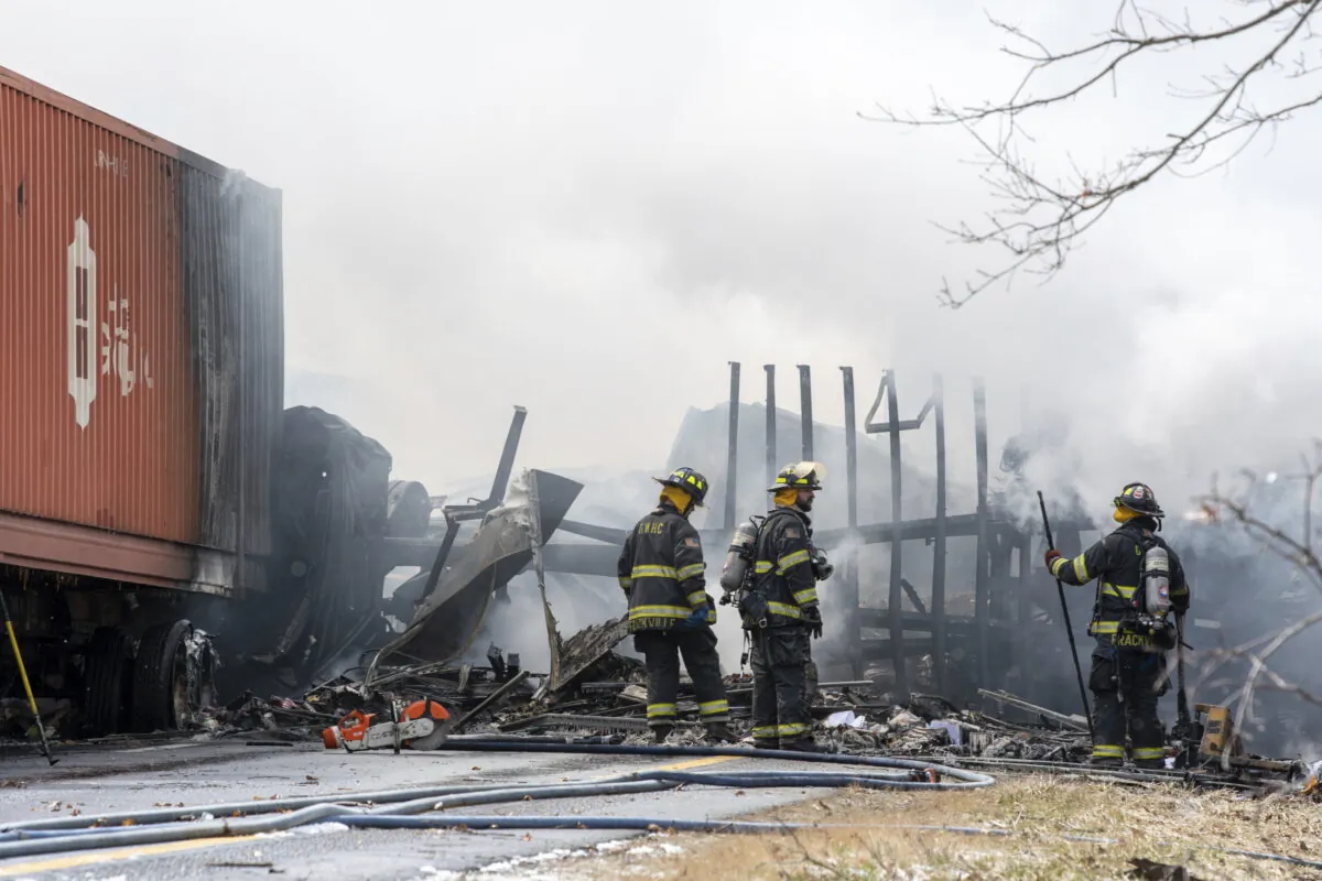 Firefighters work at the scene of a multi-vehicle crash on Interstate 81 North near the Minersville exit in Foster Township, Pa., on March 28, 2022. (David McKeown/Republican-Herald via AP)