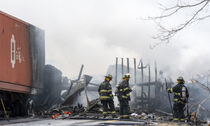 Firefighters work at the scene of a multi-vehicle crash on Interstate 81 North near the Minersville exit in Foster Township, Pa., on March 28, 2022. (David McKeown/Republican-Herald via AP)