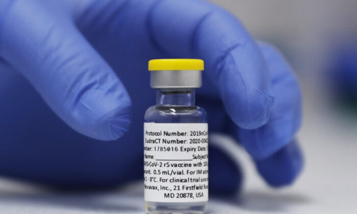 A vial of the Phase 3 Novavax coronavirus vaccine prepared for use in a trial at St. George's University hospital in London, on Oct. 7, 2020. (Alastair Grant/AP Photo)