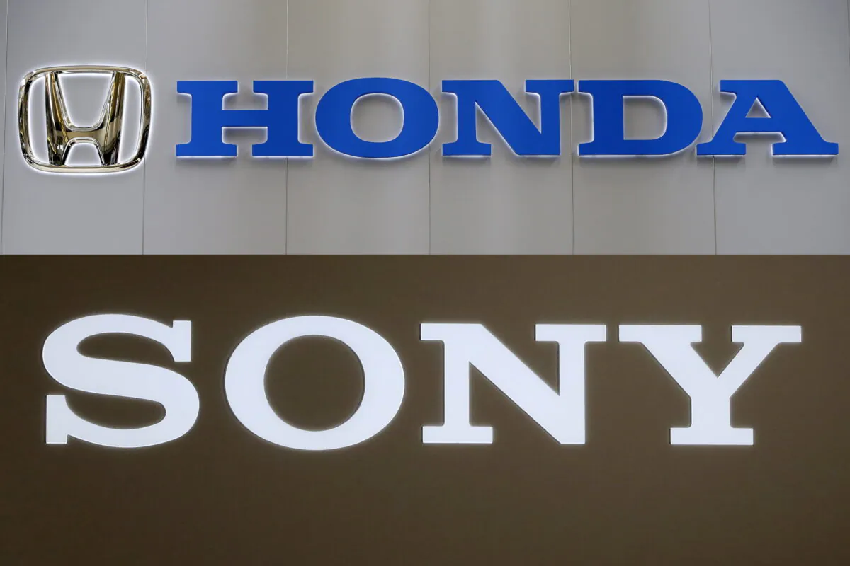 In this combination image, logos are seen for Honda Motor Co., on Feb. 14, 2013, in Pittsburgh and Sony Corp. on Nov. 14, 2018, in Tokyo. (AP Photo)
