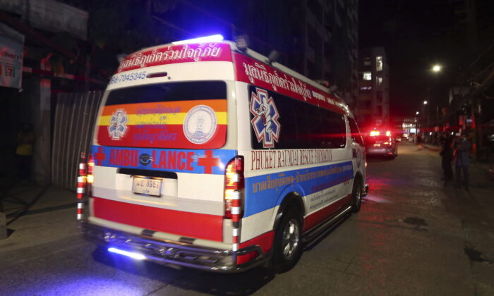An ambulance carrying the body of Shane Warne moves from Surat Thani Hospital in the southern of Thailand to Suvarnabhumi International Airport before sending him back to Australia, on March 7, 2022. (Thanapat Cherajin/AP Photo)