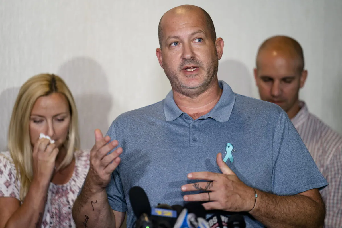 Joseph Petito (C), father of Gabby Petito, whose death on a cross-country trip has sparked a manhunt for her boyfriend Brian Laundrie, speaks during a news conference in Bohemia, New York, on Sept. 28, 2021. (John Minchillo/AP Photo)