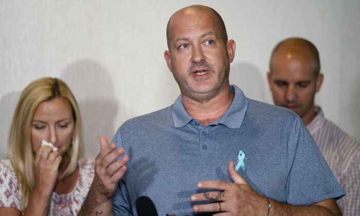Joseph Petito (C), father of Gabby Petito, whose death on a cross-country trip has sparked a manhunt for her boyfriend Brian Laundrie, speaks during a news conference in Bohemia, New York on Sept. 28, 2021. (John Minchillo/AP Photo)