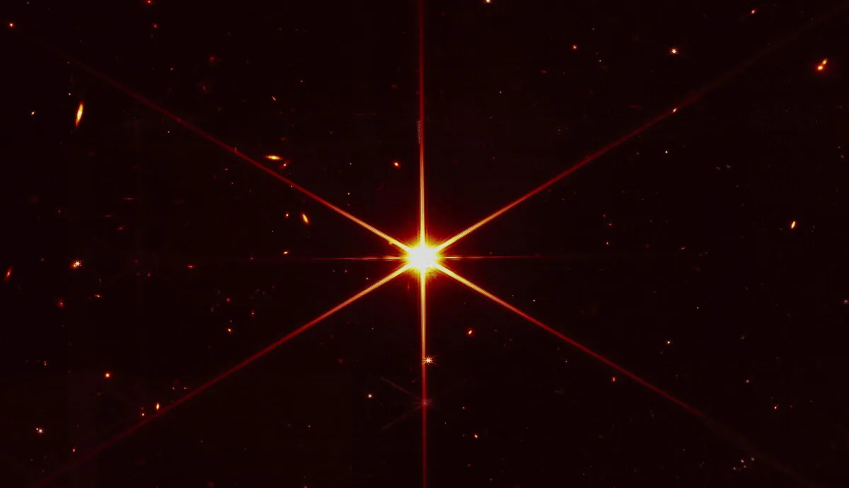 Star 2MASS J17554042+6551277 used to align the mirrors of the James Webb Space Telescope, with galaxies and stars surrounding it, in this image made available by NASA on March 16, 2022. (NASA/STScI via AP)