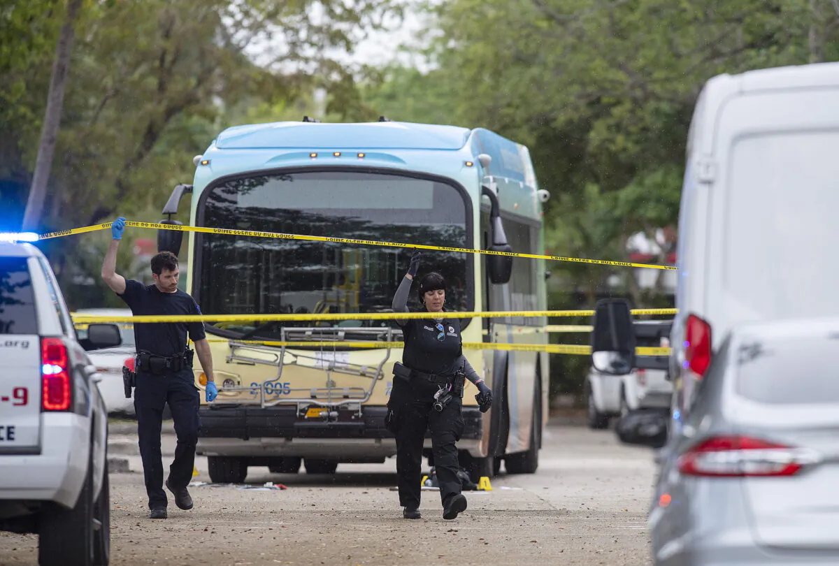 Law enforcement investigate at the scene of shooting on a Broward County Transit bus in Fort Lauderdale, Fla., on March 17, 2022. (Michael Laughlin/South Florida Sun-Sentinel via AP)