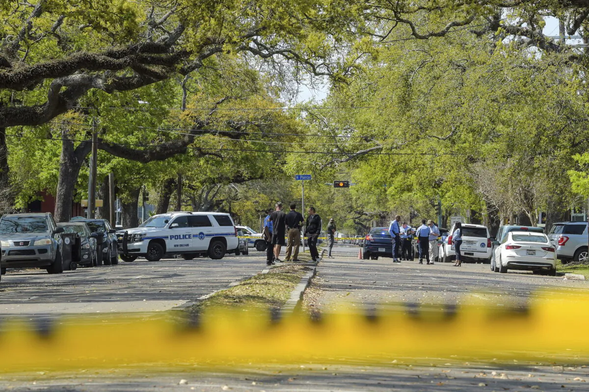 Members of the New Orleans Police Department investigate a crime scene in a file photo.  (Max Becherer/The Times-Picayune/The New Orleans Advocate via AP)