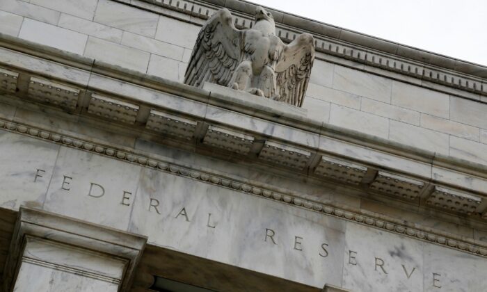 An eagle tops the U.S. Federal Reserve building's facade in Wash., on July 31, 2013.  (Jonathan Ernst/Reuters)