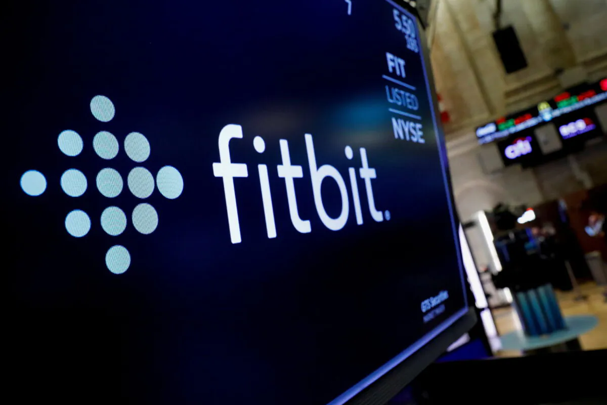 The logo for wearable device maker Fitbit Inc. is displayed on a screen of the New York Stock Exchange (NYSE) in New York on Oct. 28, 2019. (Brendan McDermid/Reuters)