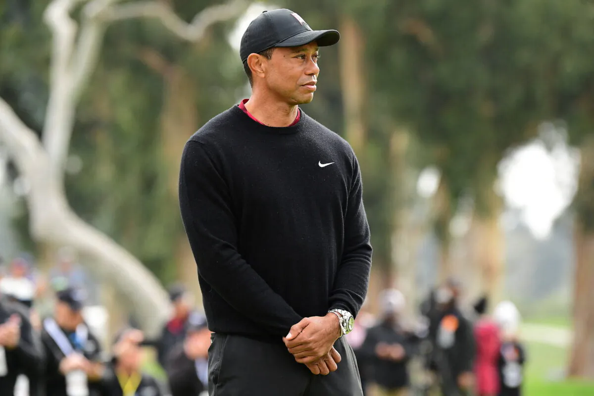Event host Tiger Woods reacts during the trophy presentation following the final round of the Genesis Invitational golf tournament in Pacific Palisades, Calif., on Feb 20, 2022. (Gary A. Vasquez/USA TODAY Sports via Reuters)